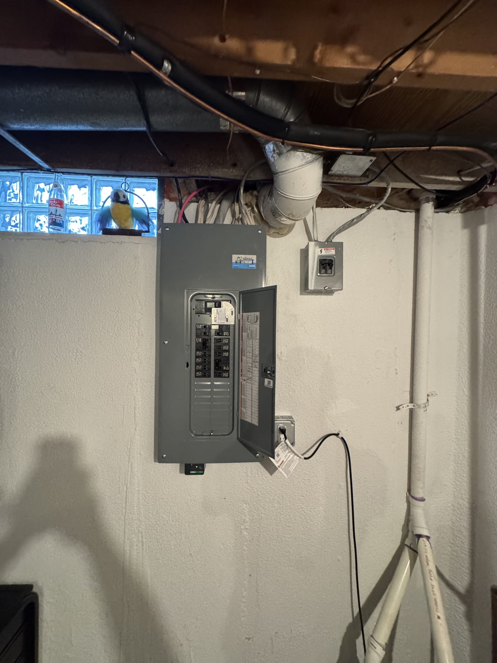 Newly installed 200-amp breaker panel in a Clinton Township, Michigan basement after a panel replacement